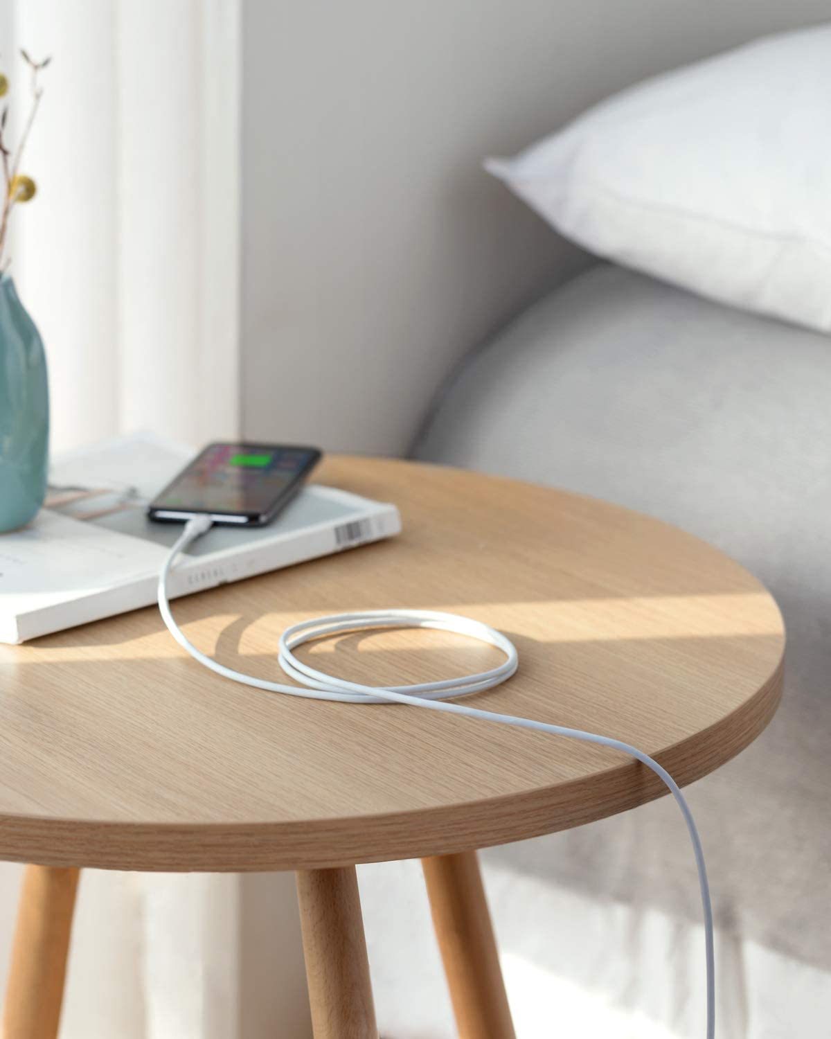 Anker cable with charging iPhone on table